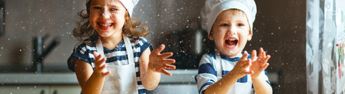 happy family  funny kids are preparing the dough, bake cookies in the kitchen